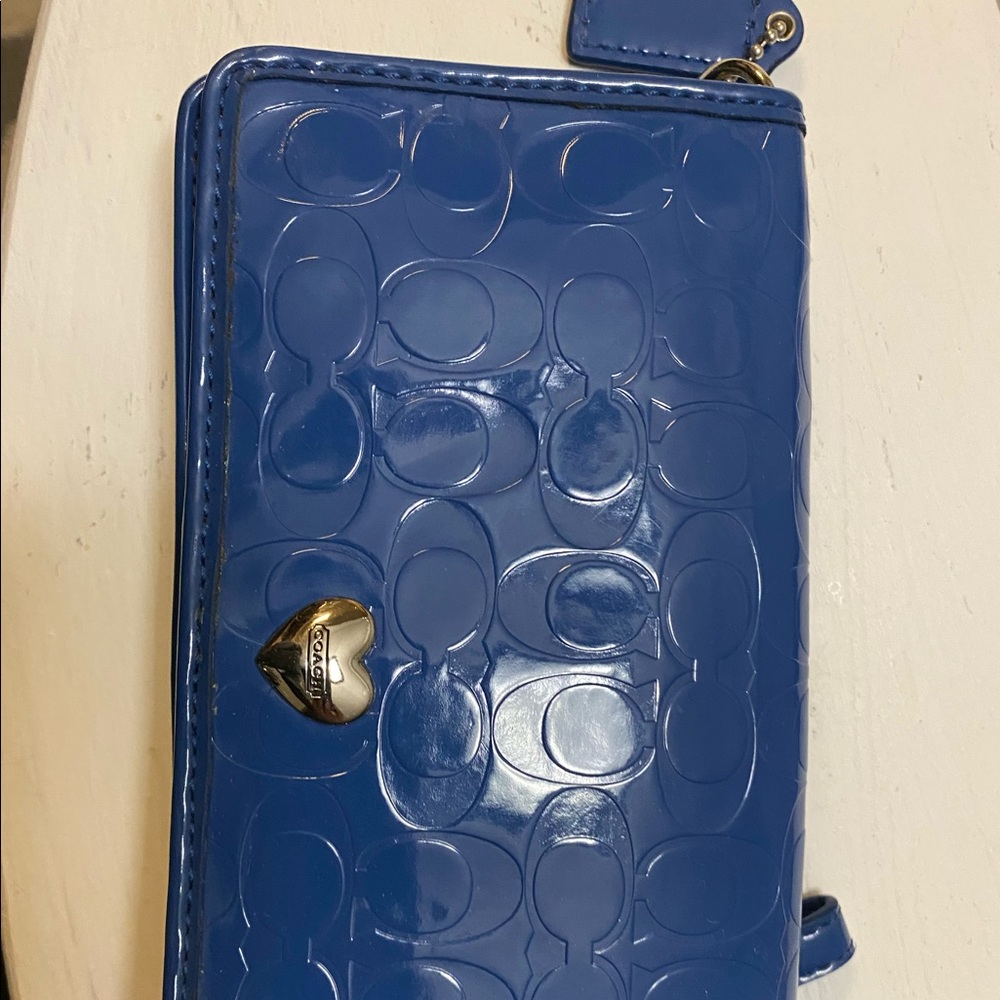 Cute blue coach wallet.Button front,zipper in back, credit card and cash pocket.